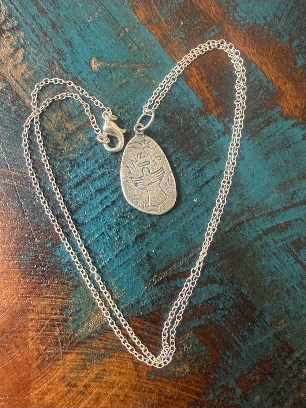 This Jes MaHarry unisex angel silver charm shines like a bright star in the sky.